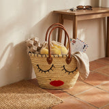 Woven Straw Tote Bag with Embroidered Face and Leather Handles